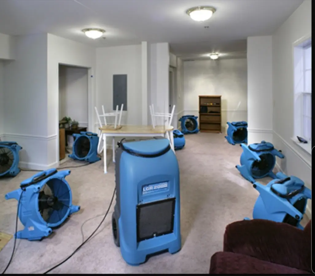 Air movers and dehumidifier setup for Water Damage Restoration in Greenwich